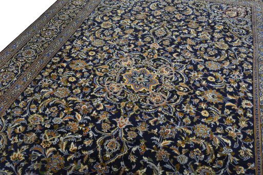 Backside of handmade 2000s Kashan rug showing knot structure and weave density