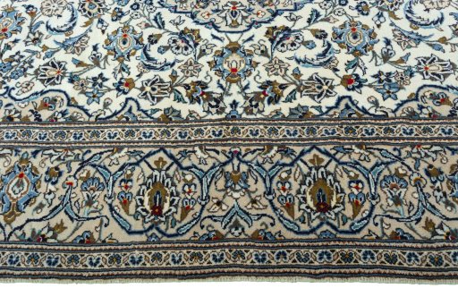 Corner detail of 2000s Kashan rug showing border pattern and Wool pile