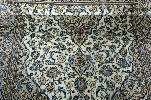 Close-up detail of 2000s Kashan rug from Iran / Persia showing Wool weave