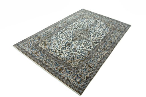 Corner detail of 2000s Kashan rug showing border pattern and Wool pile