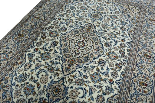 Backside of handmade 2000s Kashan rug showing knot structure and weave density