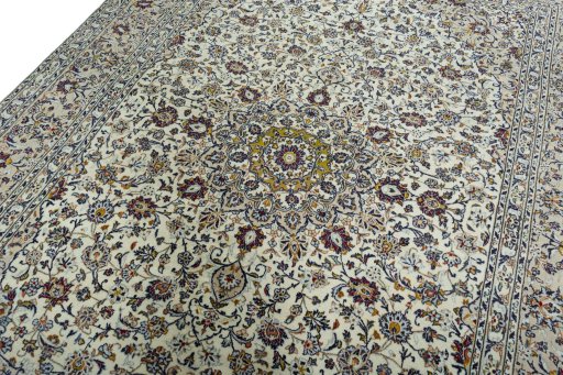 Backside of handmade 2000s Kashan rug showing knot structure and weave density