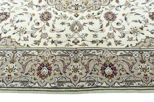 Corner detail of 2000s Kashan rug showing border pattern and Wool pile