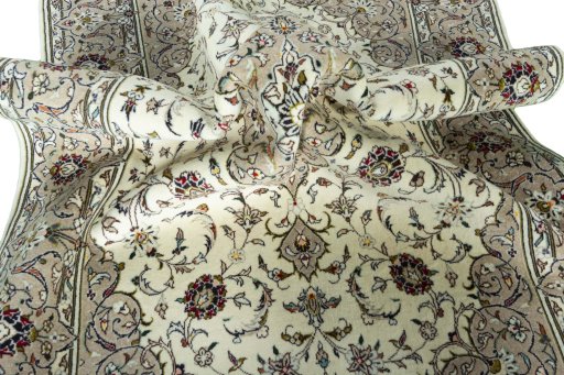 Surface texture of 2000s Kashan rug with natural Wool and intricate pattern
