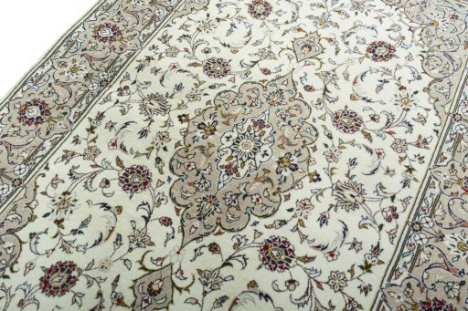 Backside of handmade 2000s Kashan rug showing knot structure and weave density