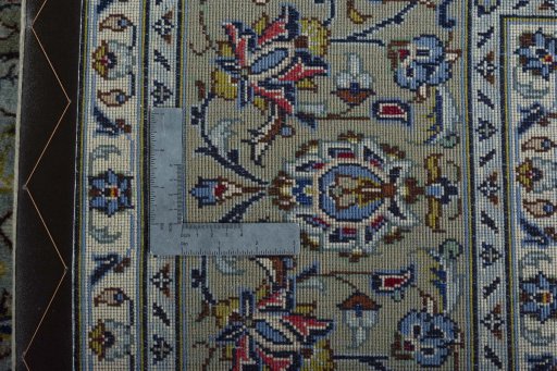 Backside of handmade New Kashan rug showing knot structure and weave density