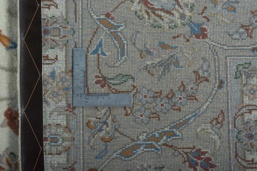 Backside of handmade New Kashan rug showing knot structure and weave density