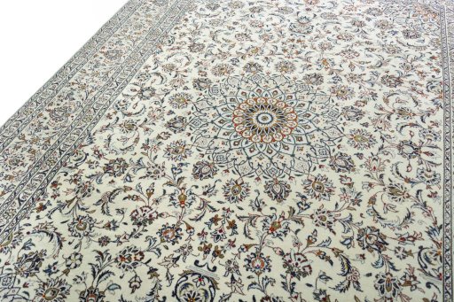 Backside of handmade 2000s Kashan rug showing knot structure and weave density