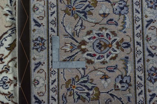 Surface texture of 2000s Kashan rug with natural Wool and intricate pattern