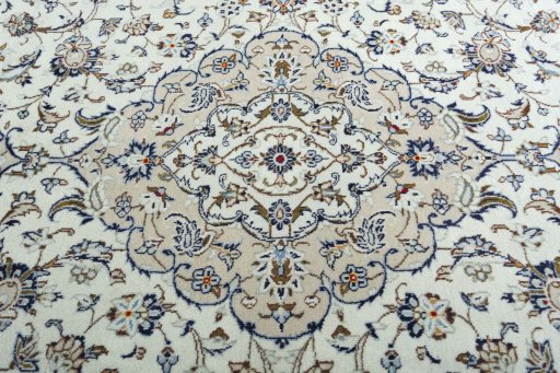 Backside of handmade 2000s Kashan rug showing knot structure and weave density