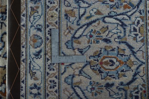 Backside of handmade 2000s Kashan rug showing knot structure and weave density
