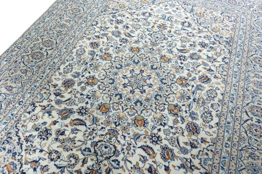 Backside of handmade 2000s Kashan rug showing knot structure and weave density