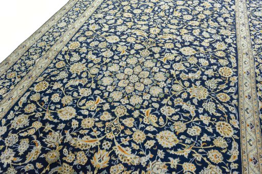 Backside of handmade 1970s Kashan rug showing knot structure and weave density