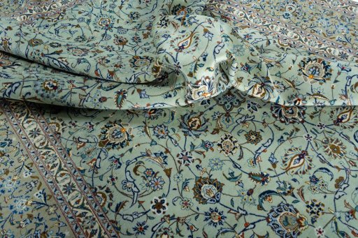 Surface texture of 2000s Kashan rug with natural Wool and intricate pattern