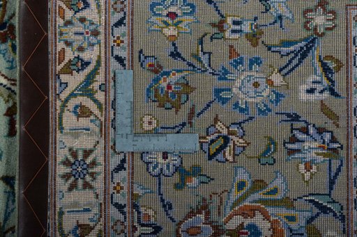 Backside of handmade 2000s Kashan rug showing knot structure and weave density