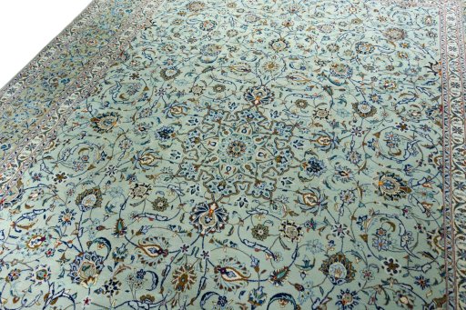 Backside of handmade 2000s Kashan rug showing knot structure and weave density