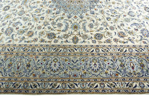 Corner detail of 2000s Kashan rug showing border pattern and Wool pile