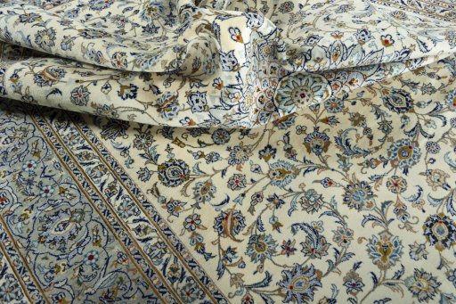 Surface texture of 2000s Kashan rug with natural Wool and intricate pattern