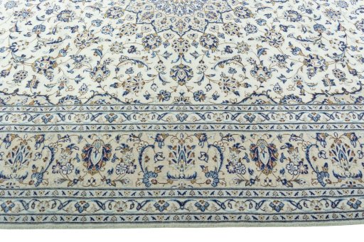 Corner detail of 2000s Kashan rug showing border pattern and Wool pile