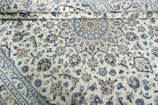 Close-up detail of 2000s Kashan rug from Iran / Persia showing Wool weave