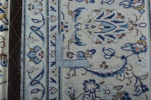 Backside of handmade 2000s Kashan rug showing knot structure and weave density