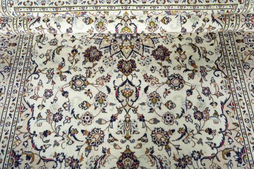 Close-up detail of 2000s Kashan rug from Iran / Persia showing Wool weave