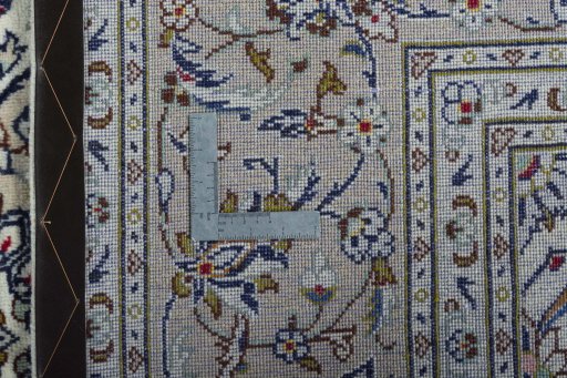 Backside of handmade 2000s Kashan rug showing knot structure and weave density