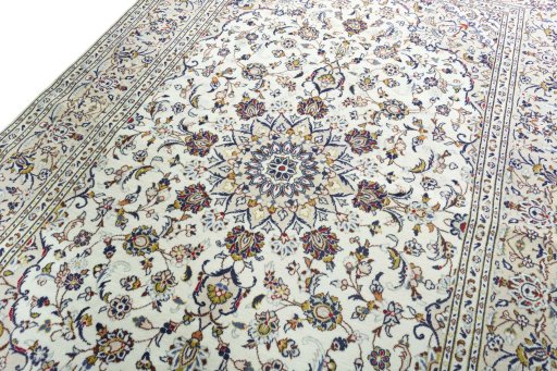 Backside of handmade 2000s Kashan rug showing knot structure and weave density