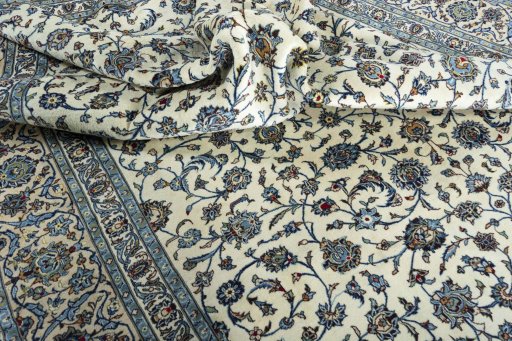Surface texture of 2000s Kashan rug with natural Wool and intricate pattern