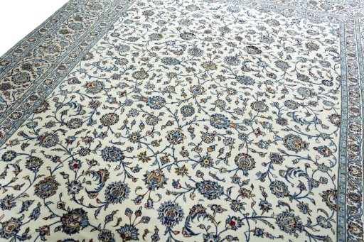 Backside of handmade 2000s Kashan rug showing knot structure and weave density