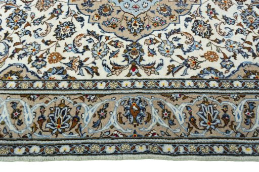 Corner detail of 2000s Kashan rug showing border pattern and Wool pile