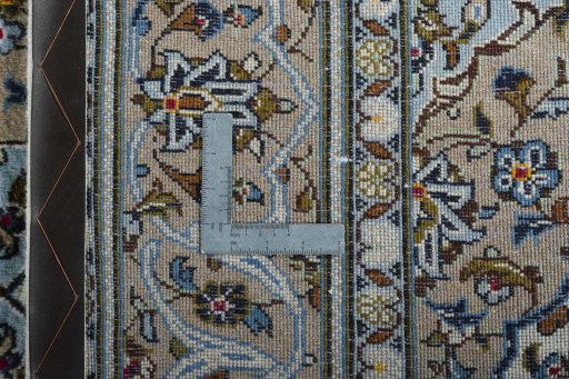 Backside of handmade 2000s Kashan rug showing knot structure and weave density