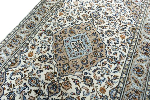 Backside of handmade 2000s Kashan rug showing knot structure and weave density