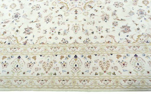 Corner detail of New Kashan rug showing border pattern and Wool pile
