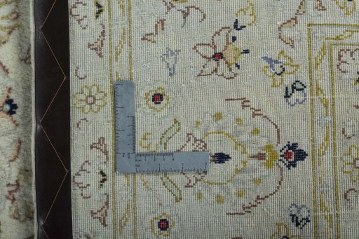 Backside of handmade New Kashan rug showing knot structure and weave density