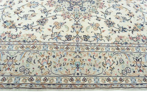 Corner detail of 2000s Kashan rug showing border pattern and Wool pile