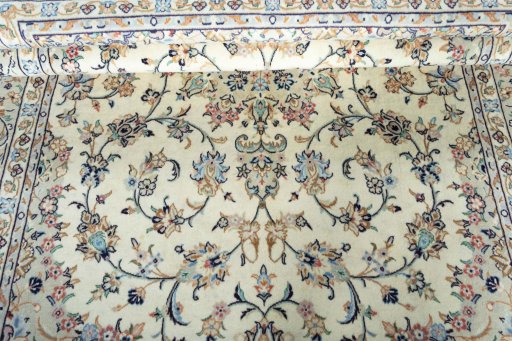 Close-up detail of 2000s Kashan rug from Iran / Persia showing Wool weave