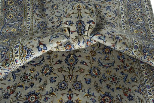Surface texture of 2000s Kashan rug with natural Wool and intricate pattern