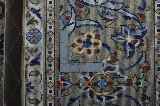 Backside of handmade 2000s Kashan rug showing knot structure and weave density
