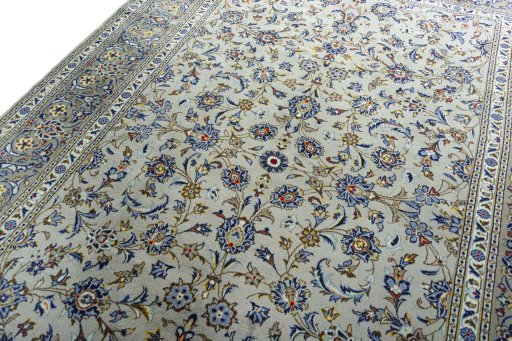 Backside of handmade 2000s Kashan rug showing knot structure and weave density