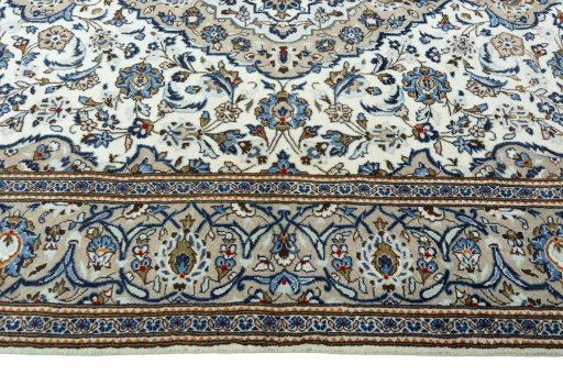 Corner detail of 2000s Kashan rug showing border pattern and Wool pile