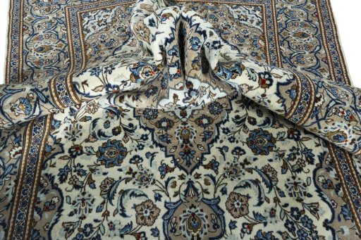 Surface texture of 2000s Kashan rug with natural Wool and intricate pattern
