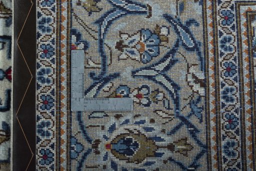 Backside of handmade 2000s Kashan rug showing knot structure and weave density