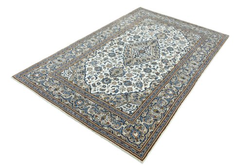 Corner detail of 2000s Kashan rug showing border pattern and Wool pile