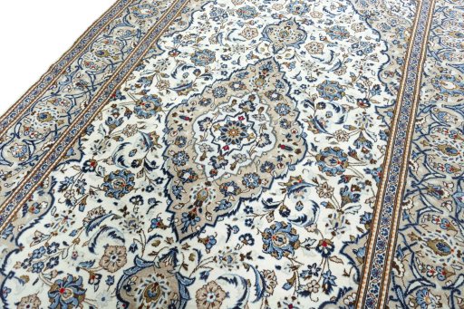 Backside of handmade 2000s Kashan rug showing knot structure and weave density