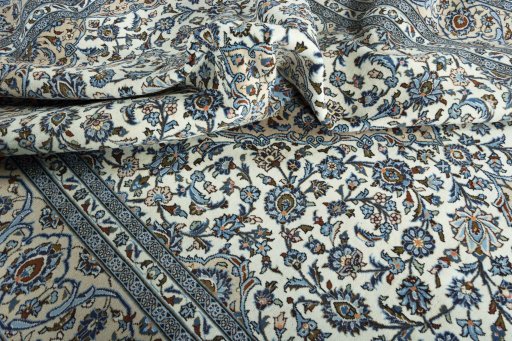 Surface texture of 2000s Kashan rug with natural Wool and intricate pattern