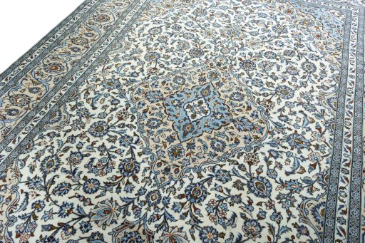 Backside of handmade 2000s Kashan rug showing knot structure and weave density