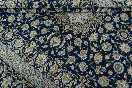 Close-up detail of 2000s Kashan rug from Iran / Persia showing Wool weave