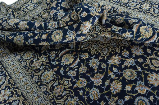 Surface texture of 2000s Kashan rug with natural Wool and intricate pattern