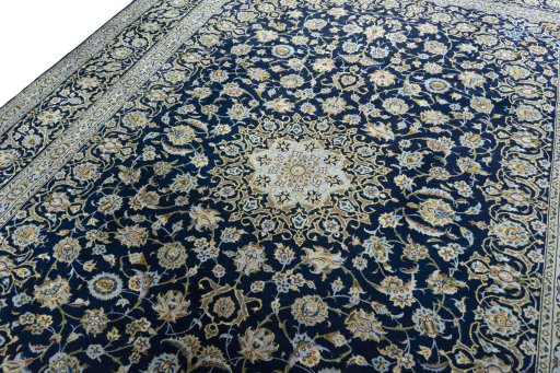 Backside of handmade 2000s Kashan rug showing knot structure and weave density